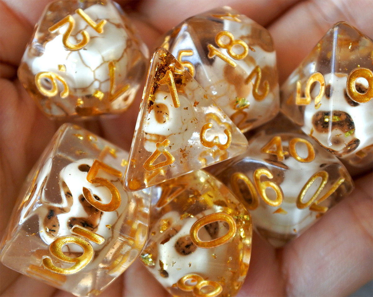 Skulls Laying in Golden Treasure Dice Set